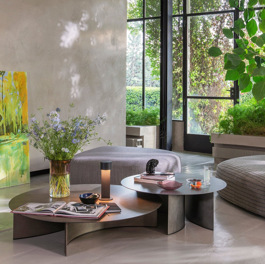 Pierre low tables by Flou in brushed metal finish, styled in a serene modern living room