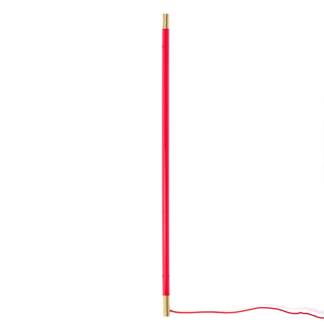 Seletti Linea Golden End Red, slim red LED tube with brass end caps and a red cord, unlit on white
