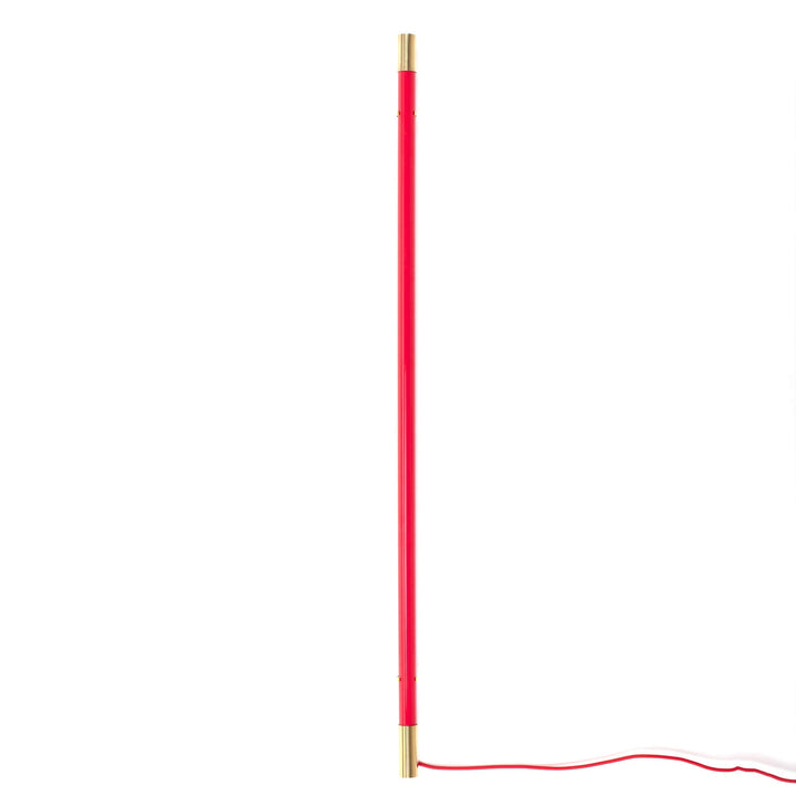 Seletti Linea Golden End Red, slim red LED tube with brass end caps and a red cord, unlit on white