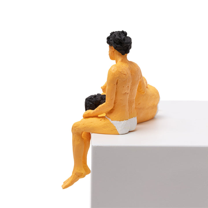 Seletti Love Is a Verb Theo &amp; Elena Figurine, side view of the seated figure cradling the reclining one
