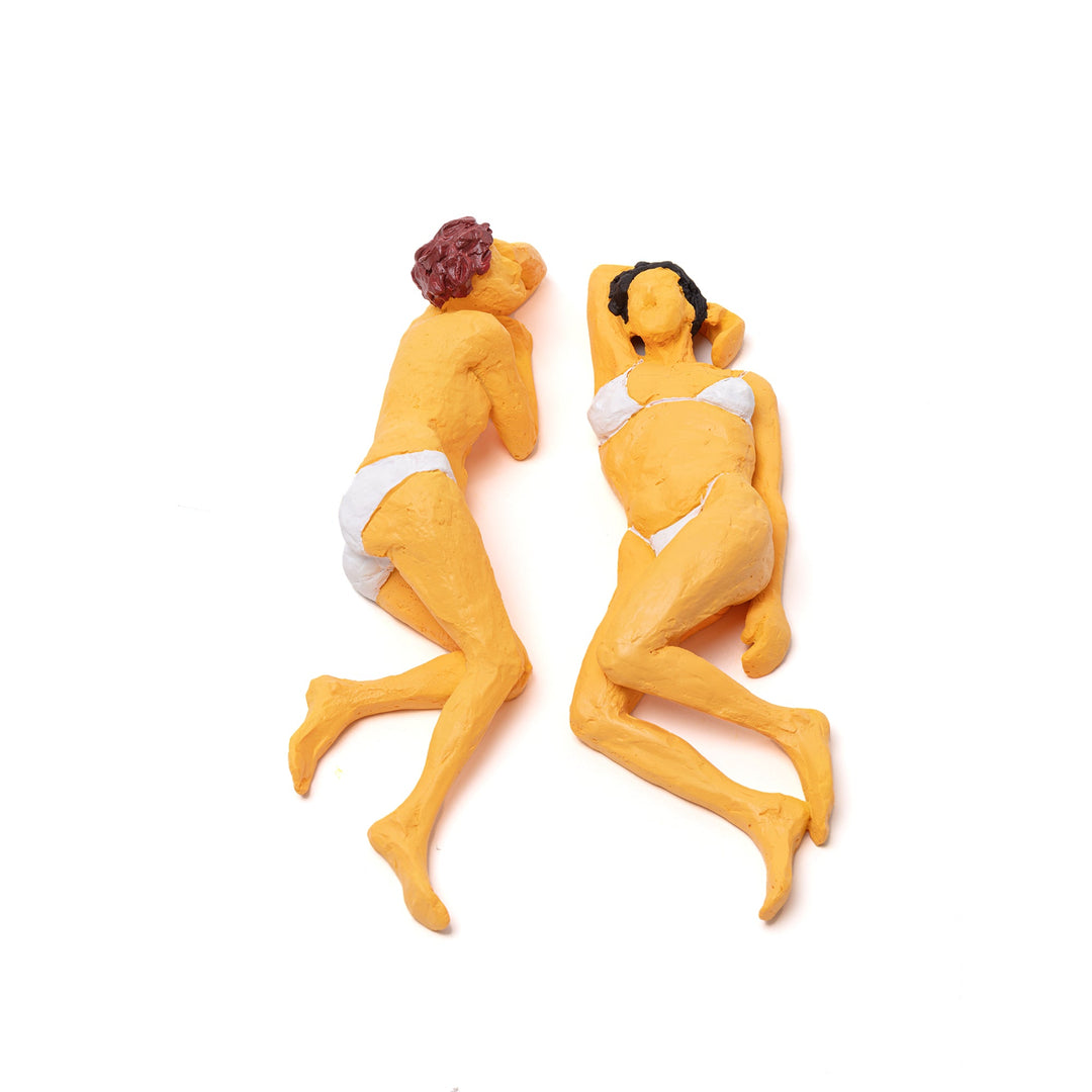 Seletti Love Is a Verb Maya &amp; Sofia Figurine, two ochre resin women in white bikinis lying head to head, top view
