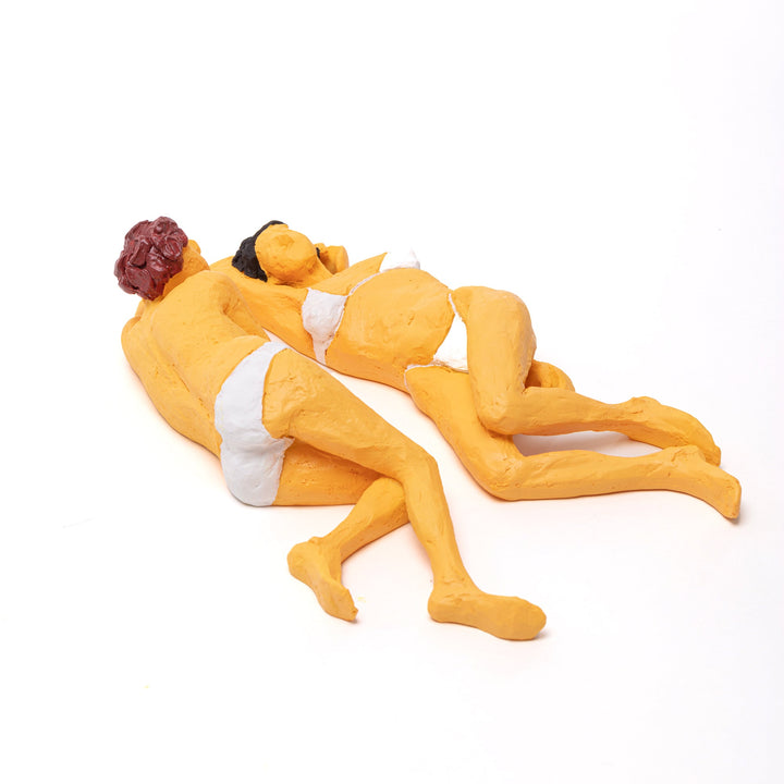 Seletti Love Is a Verb Maya &amp; Sofia Figurine, the two women curled together, seen from the side