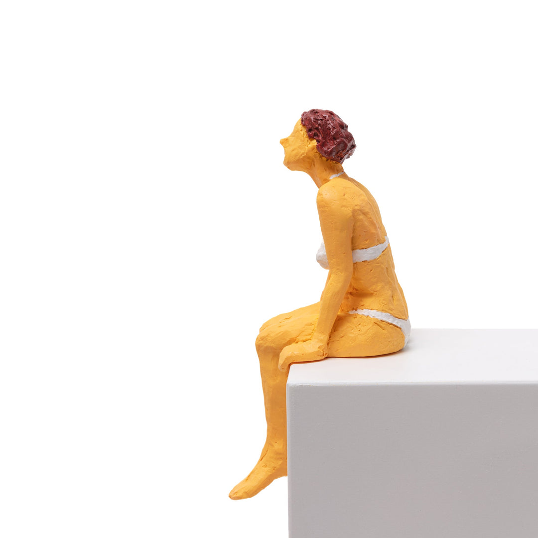 Seletti Love Is a Verb Tanya Figurine, side view of the seated woman looking up