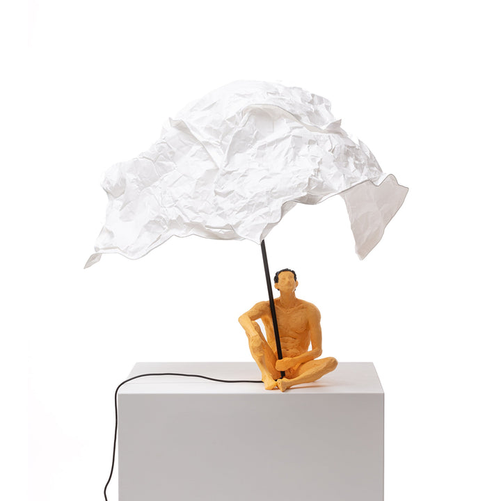Seletti Love Is a Verb Lamp Roby, seated resin man under a crumpled white paper shade on a single rod, unlit