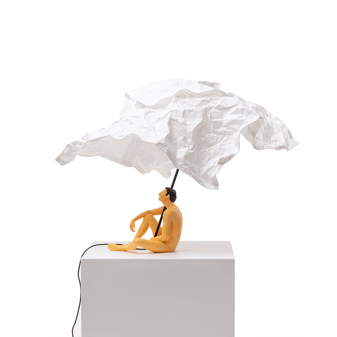 Seletti Love Is a Verb Lamp Roby, side view of the cross-legged figure and black rod