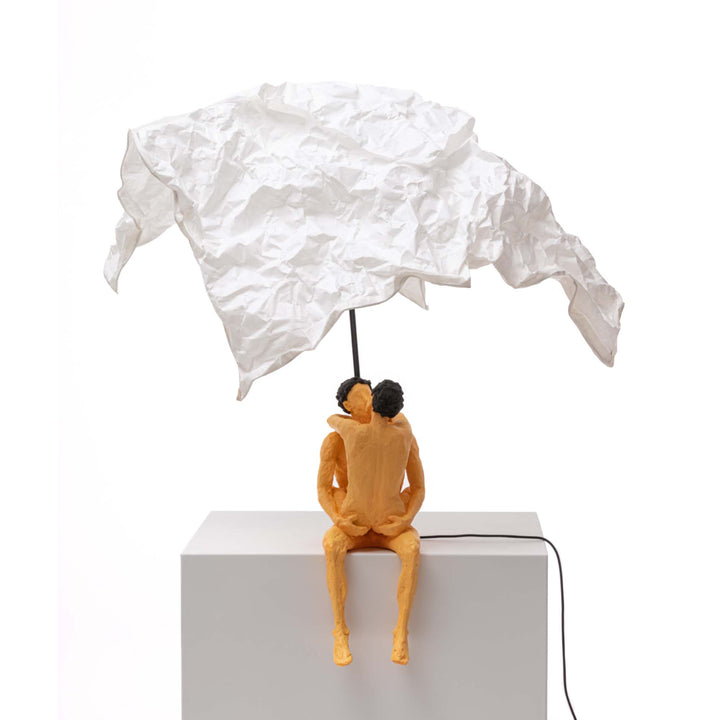 Seletti Love Is a Verb Lamp Max &amp; Roberta, resin couple kissing on a ledge under a draped white paper shade, unlit