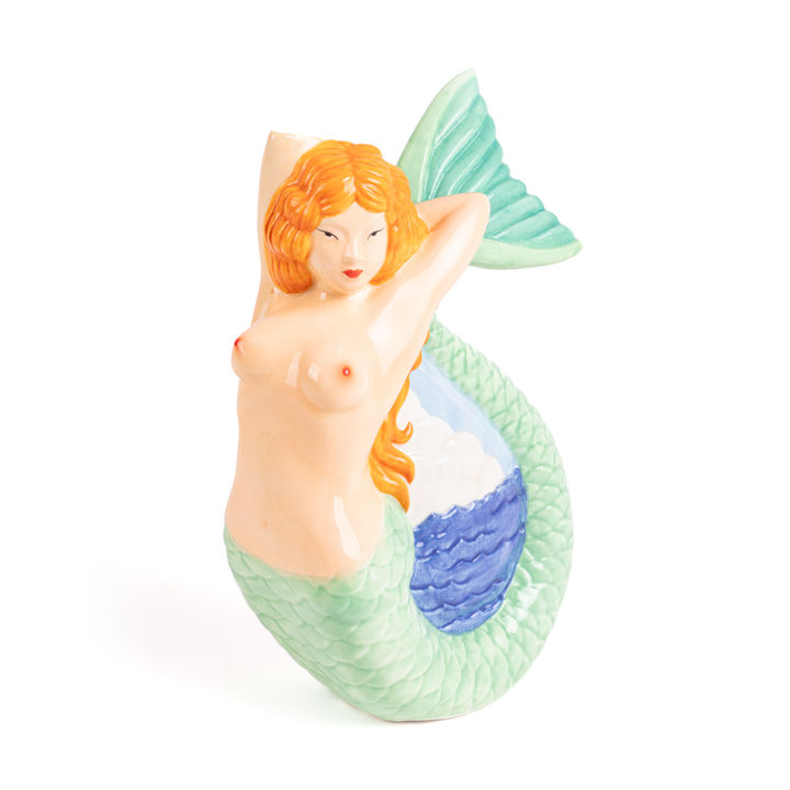Seletti Mermaid Ceramic Pitcher, ceramic mermaid with red hair and a green scaled tail curled around blue waves