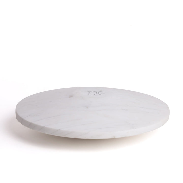 Seletti Lvdis Marble Weight Disk, white marble weight disk engraved with the Roman numeral IX, angled view
