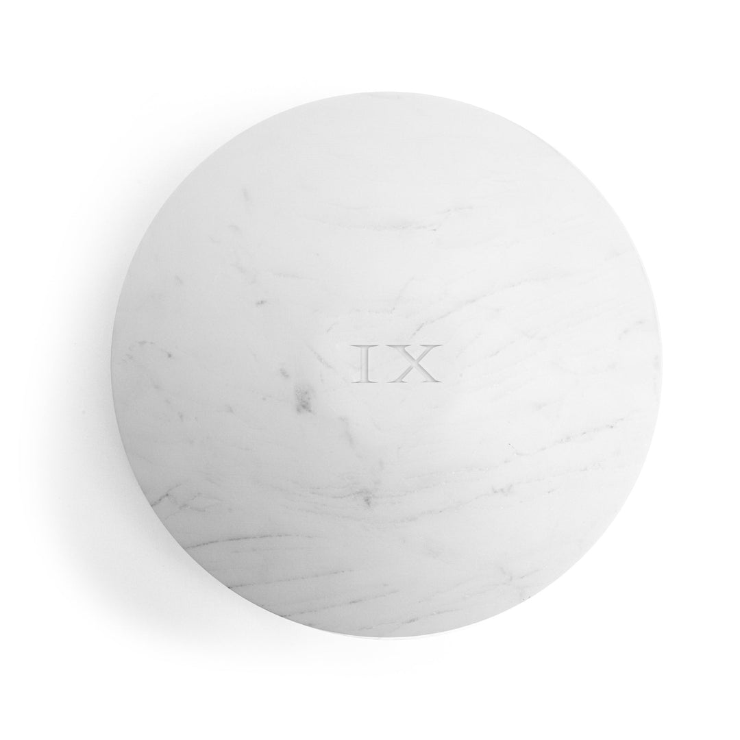 Seletti Lvdis Marble Weight Disk, top view of the veined marble face and IX inscription