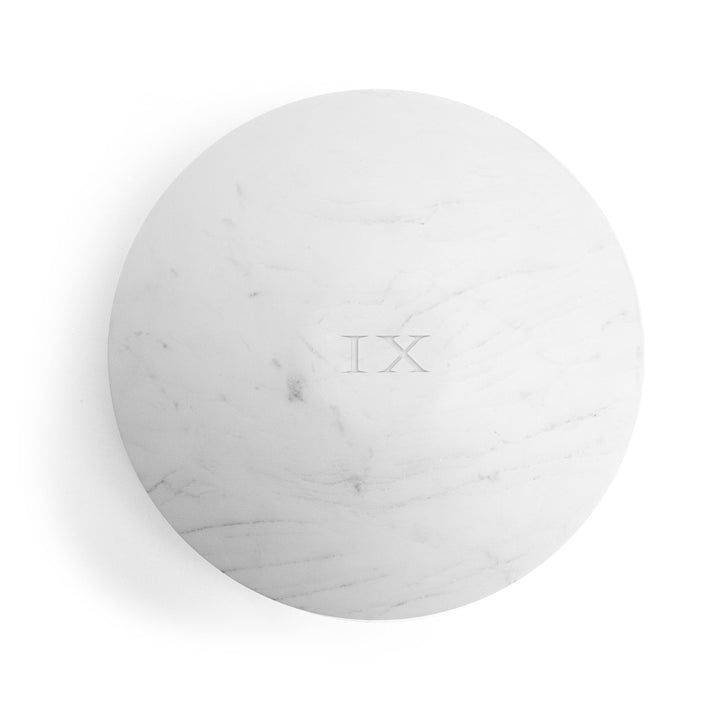Seletti Lvdis Marble Weight Disk, top view of the veined marble face and IX inscription