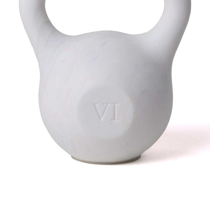 Seletti Lvdis Marble Kettlebell, close-up of the honed marble body and engraved VI