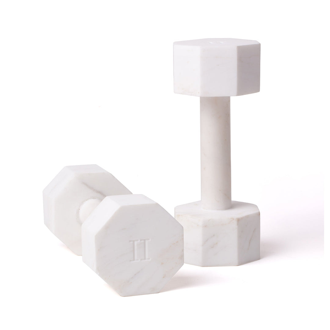 Seletti Lvdis Marble Dumbbells 2 kg (Set of 2), pair of white marble dumbbells with octagonal ends, one standing, one lying