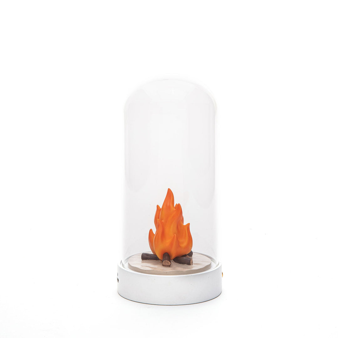 Seletti My Little Bonfire, miniature campfire under a clear glass dome on a white base, unlit