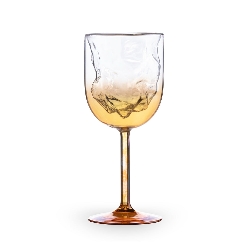 Seletti Cosmic Diner Meteorite Wine Glass, second view of the wine glass's dented bowl and amber gradient
