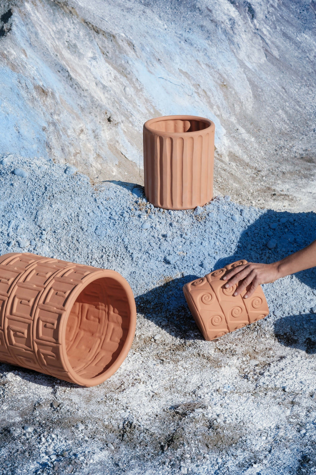 Seletti Magna Graecia Terracotta Vase Dorico, pots from the collection styled on pale rock in the sun