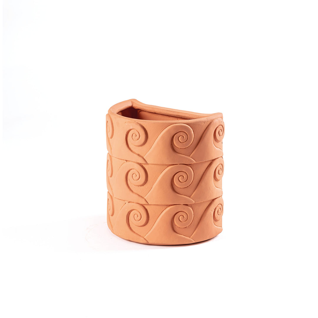 Seletti Magna Graecia Terracotta Wall Vase Onde, angled view of the spiral wave pattern