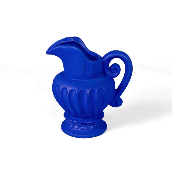 Seletti Magna Graecia Terracotta Caraffa Blue, the blue jug turned to show its curled handle