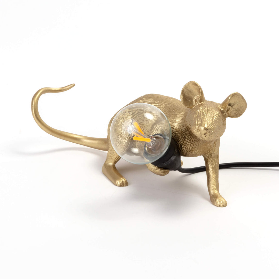 Seletti Mouse Lamp Lop Lying Down Gold, gold resin mouse lying down hugging a clear glass bulb, black cord trailing