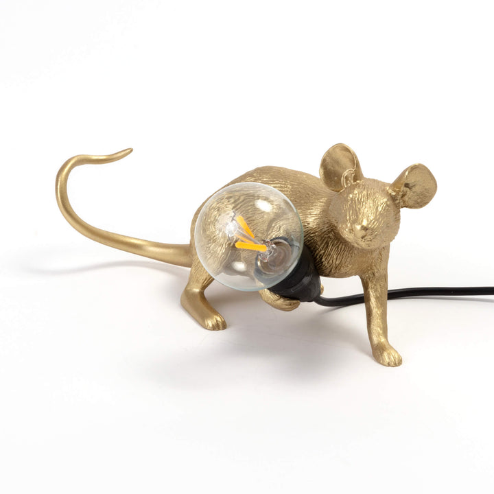 Seletti Mouse Lamp Lop Lying Down Gold, gold resin mouse lying down hugging a clear glass bulb, black cord trailing