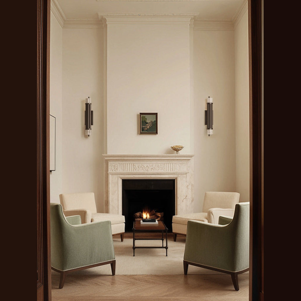 Pair of Tasta Wall Lamps flanking a marble fireplace in a cream sitting room with green armchairs