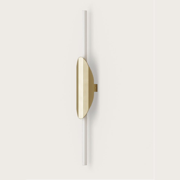Xago Wall Lamp in Aged Gold, vertical opal rod with curved gold metal shield, unlit