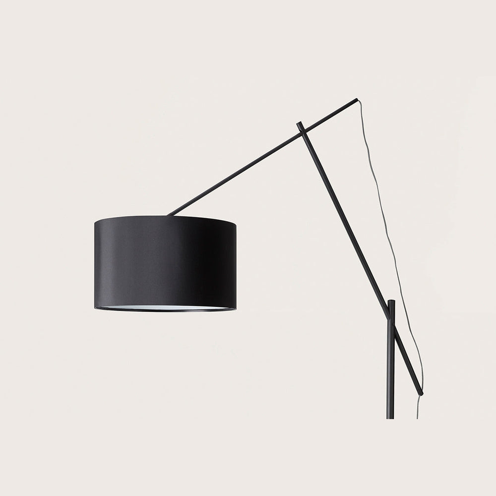 Ario Floor Lamp close-up of the black cotton drum shade and slender boom arm