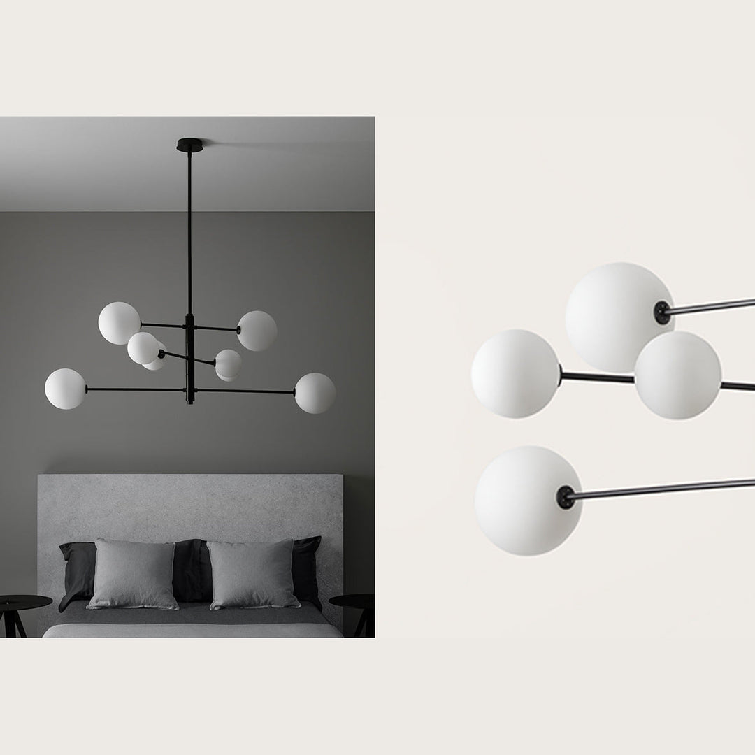Atom Chandelier in matt black with opal globes above a grey upholstered bed, plus a close-up of the globes