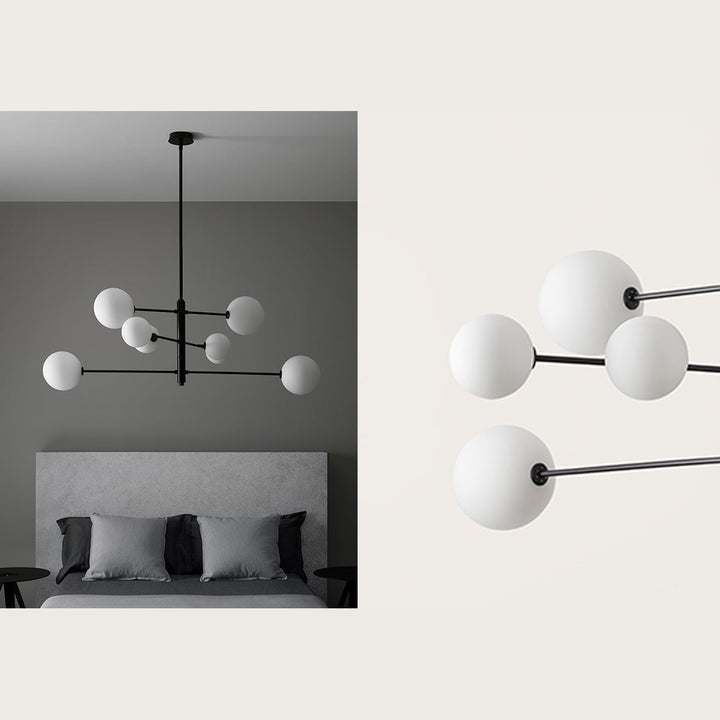 Atom Chandelier in matt black with opal globes above a grey upholstered bed, plus a close-up of the globes