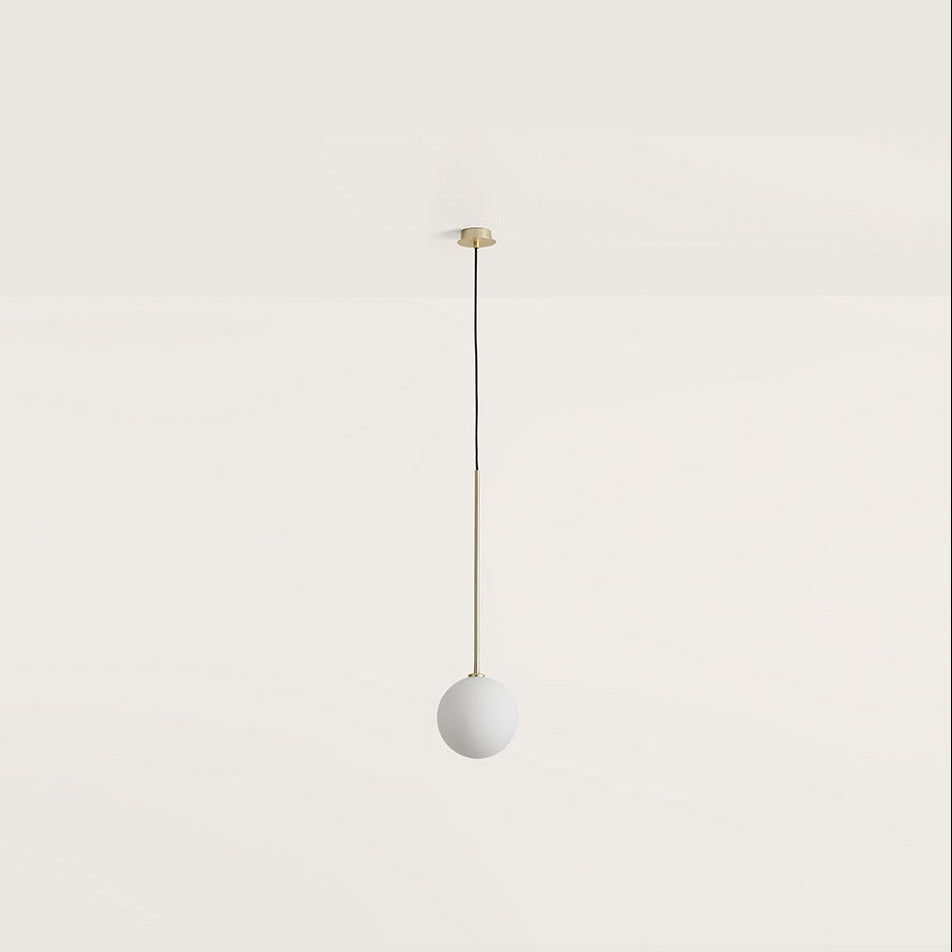 Ball Pendant Lamp with an opal glass globe on a slim brass rod and black cord, hanging, by Aromas del Campo