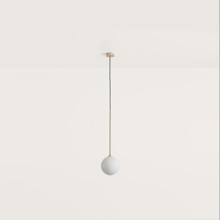 Ball Pendant Lamp with an opal glass globe on a slim brass rod and black cord, hanging, by Aromas del Campo