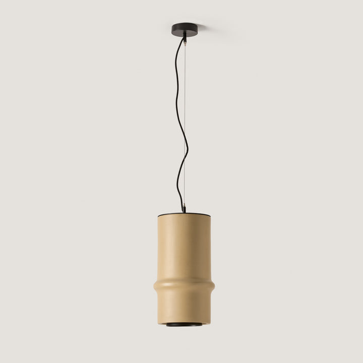 Bambu Pendant with a sand-coloured ceramic cylinder shaped like a bamboo stalk on a black cord, by Aromas del Campo