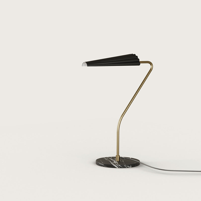 Bion Table Lamp with gold curved stem, black pleated shade and black marble base, by Aromas del Campo