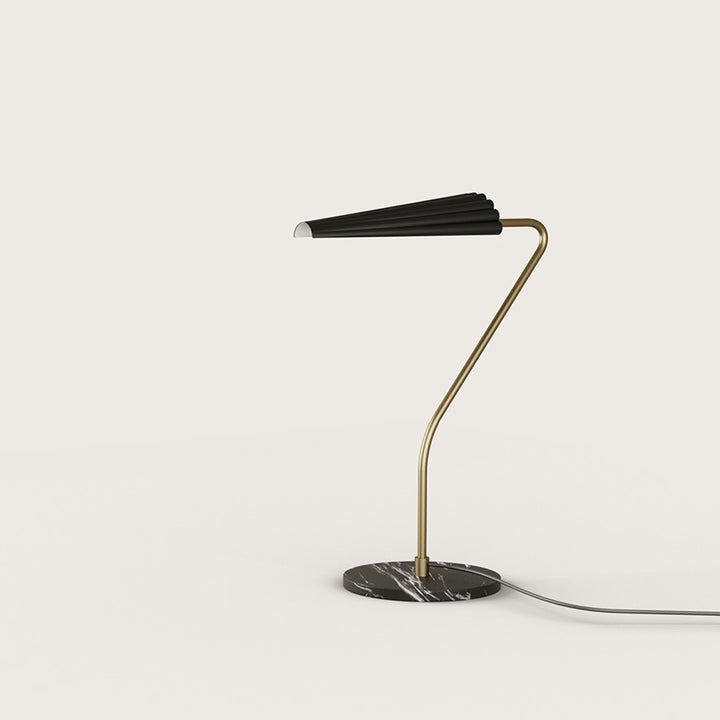 Bion Table Lamp with gold curved stem, black pleated shade and black marble base, by Aromas del Campo