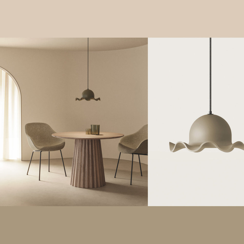 Chapéu Pendant Lamp in taupe over a round fluted dining table with two upholstered chairs