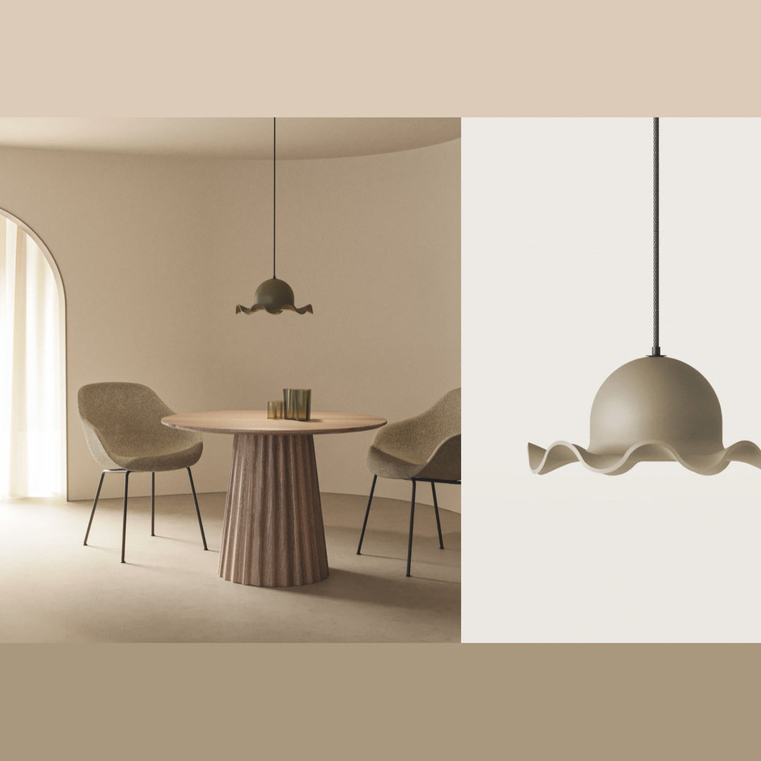 Chapéu Pendant Lamp in taupe over a round fluted dining table with two upholstered chairs