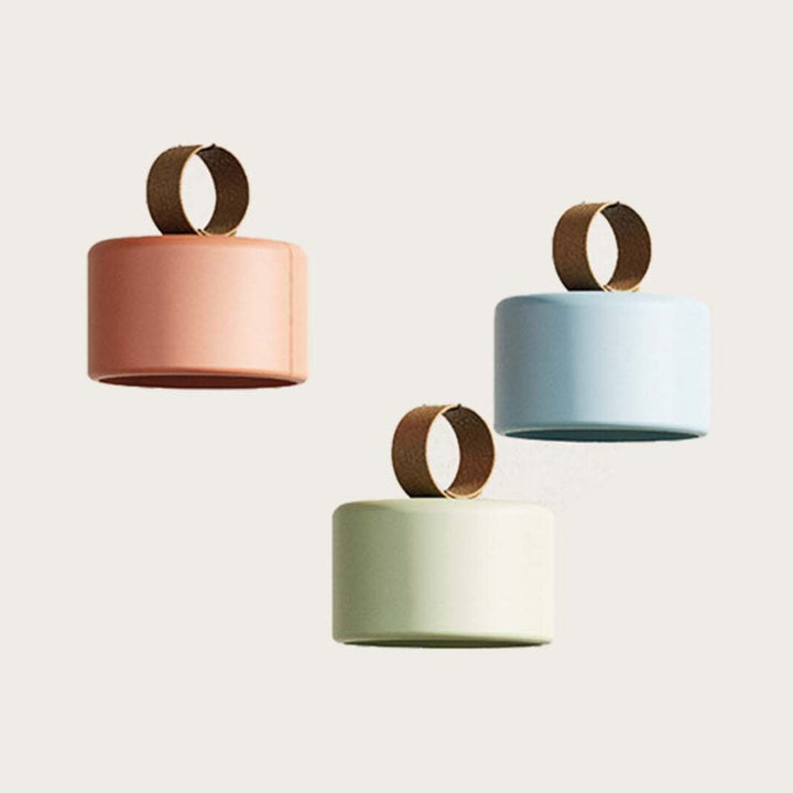 Cora Portable Lamp in coral, sky blue and sage ceramic with brown faux leather ring handles, by Aromas del Campo