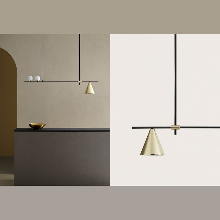 Crane Linear Pendant hanging over a dark counter with arched doorway and a brass bowl