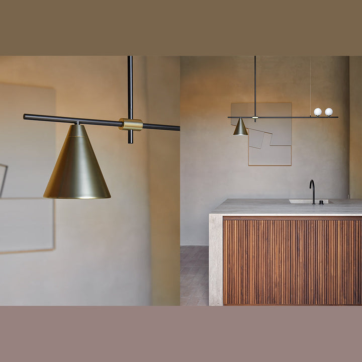 Crane Linear Pendant brass cone shade above a kitchen with fluted wood island and plaster walls