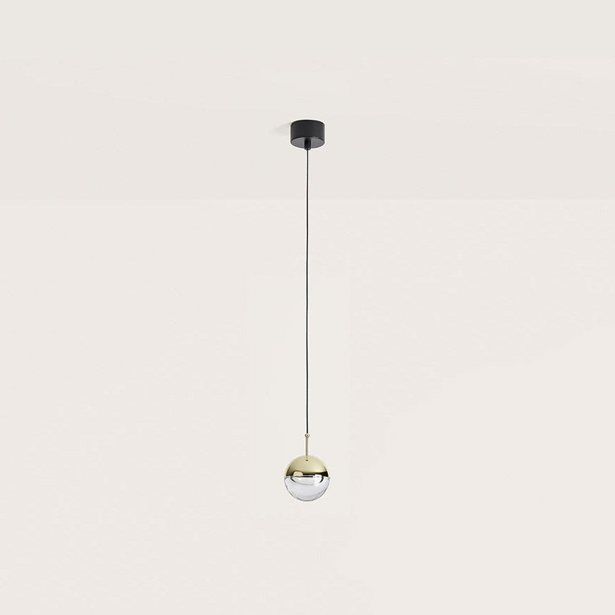 Dora Pendant Lamp, small shiny gold and clear optic glass sphere on a long black cable, by Aromas del Campo