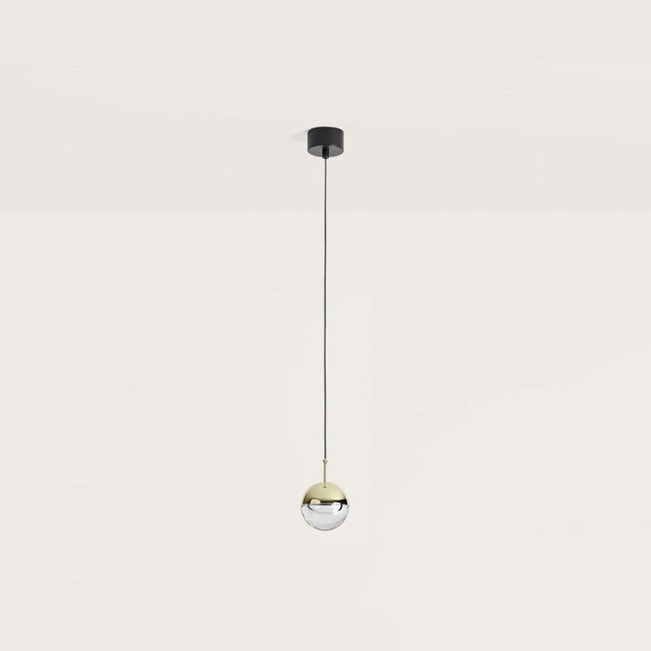 Dora Pendant Lamp, small shiny gold and clear optic glass sphere on a long black cable, by Aromas del Campo