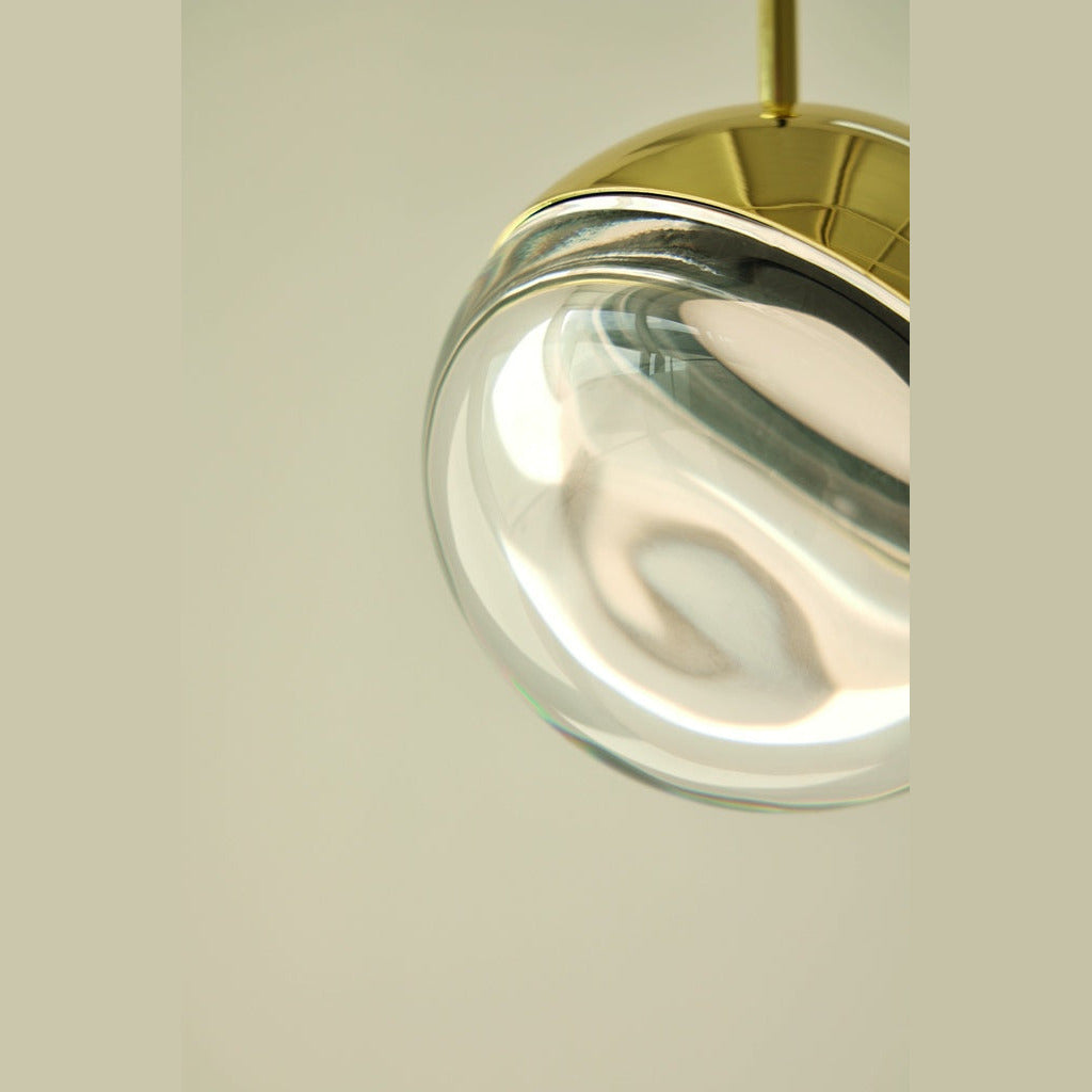 Dora Pendant Lamp glass globe detail against a pale green wall