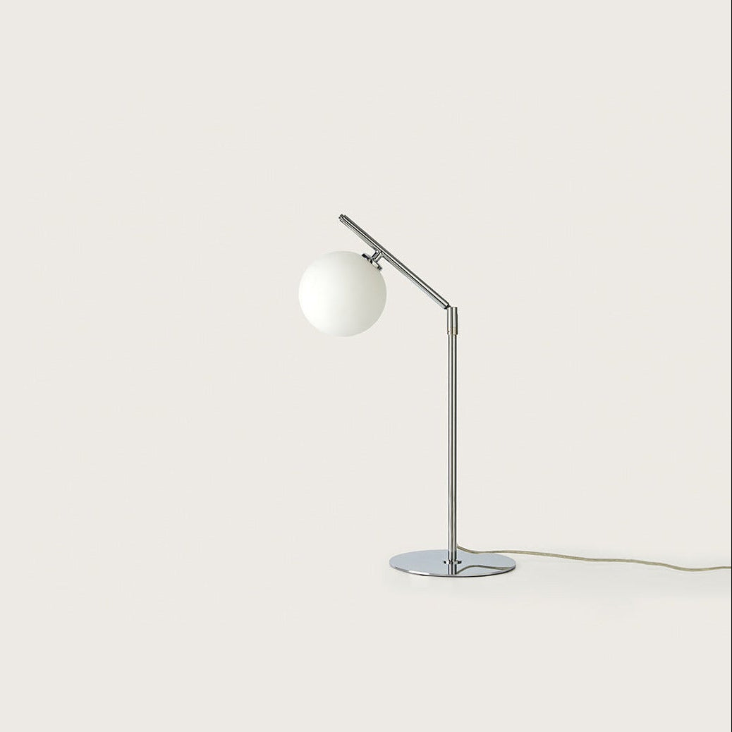 Endo Table Lamp in chrome with angled arm and opal glass globe, unlit, by Aromas del Campo
