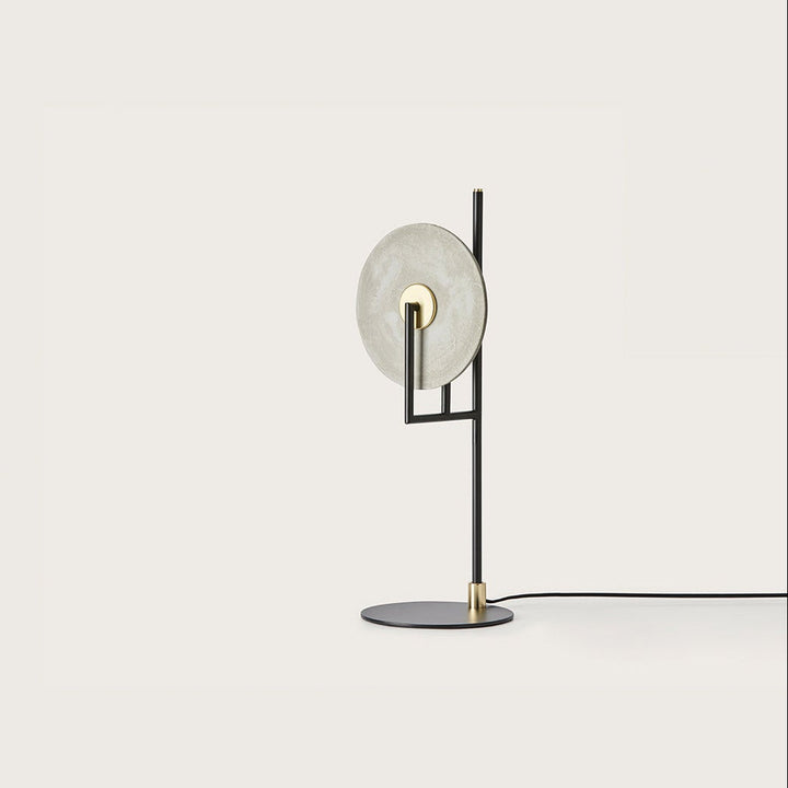 Erto Table Lamp with white alabaster disc diffuser on a black frame with brass details by Aromas del Campo