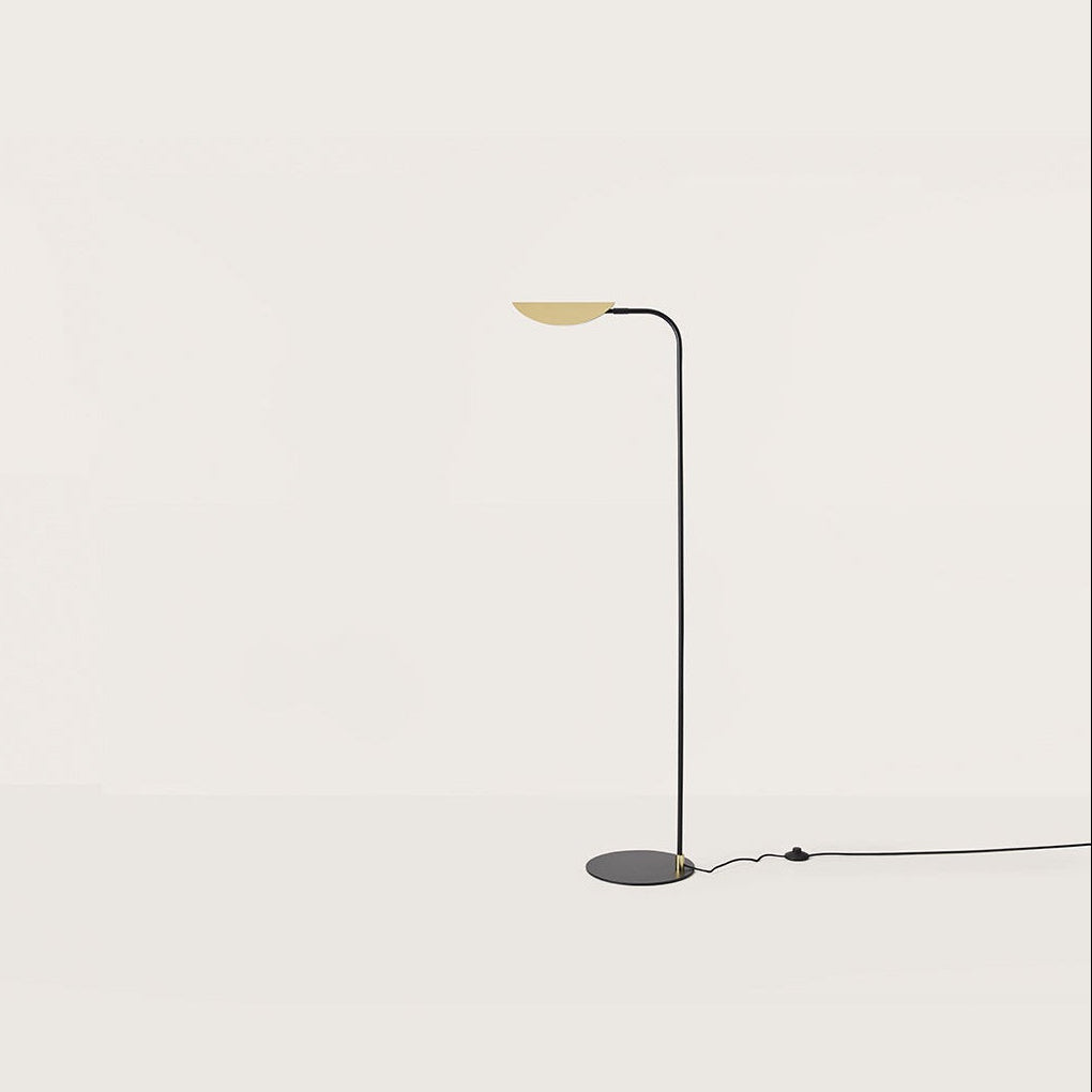 Ficus Floor Lamp with curved matt black stem and leaf-shaped matt brass shade by Aromas del Campo