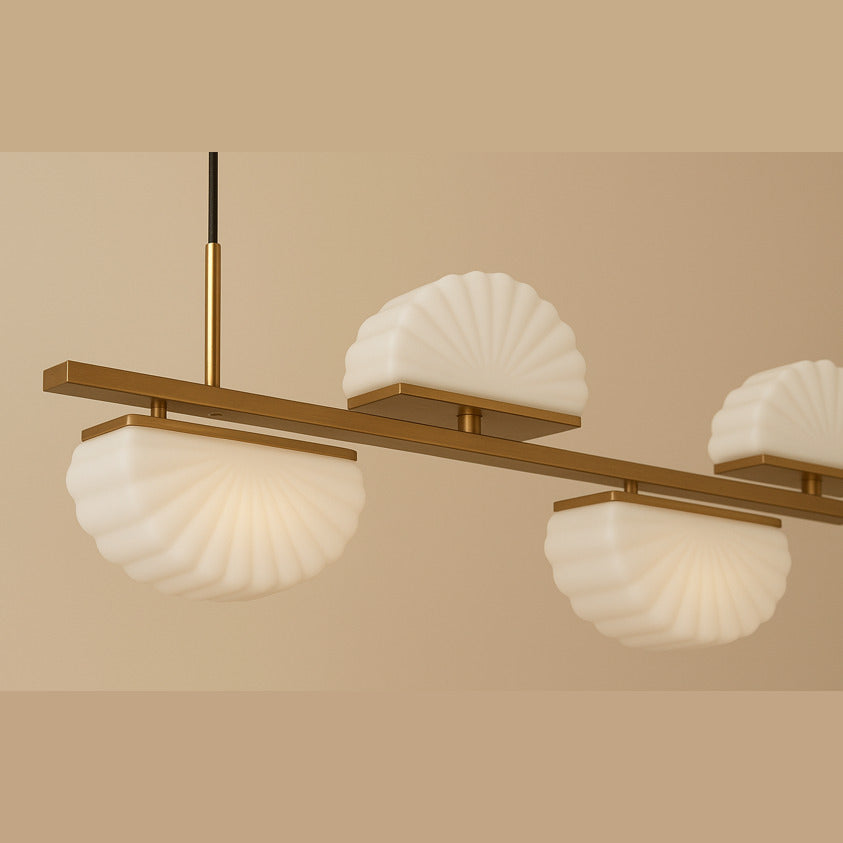 Gina Linear Pendant Linear Pendant in gold, lit, close-up of opal shell shades on the bar