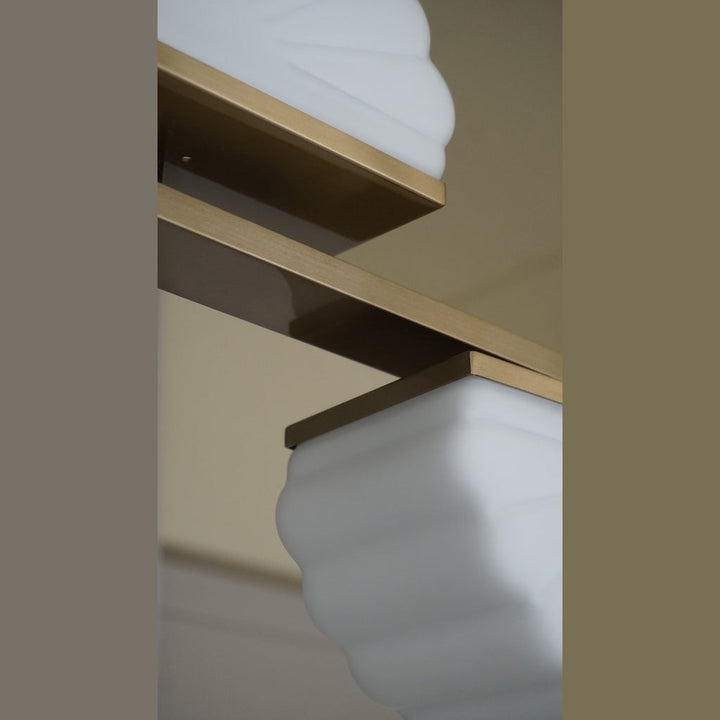 Gina Linear Pendant Linear Pendant detail of a ribbed opal glass shade under a gold bracket