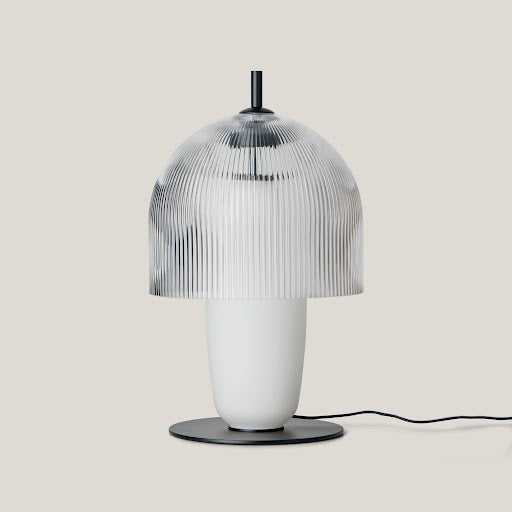 Holm Table Lamp on a pale backdrop, fluted clear dome above a white opal glass base