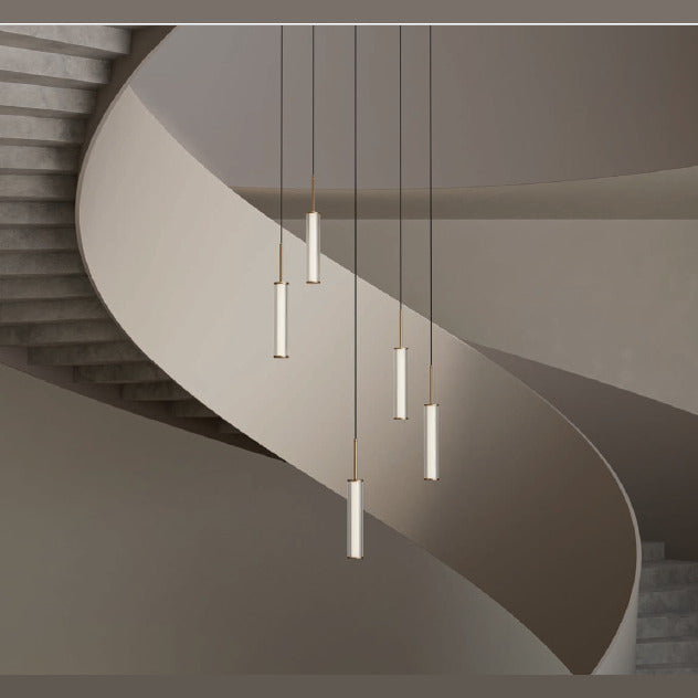 Ison Single Pendant Composition: five slim lit tube pendants hung in a curved stairwell, by Aromas del Campo