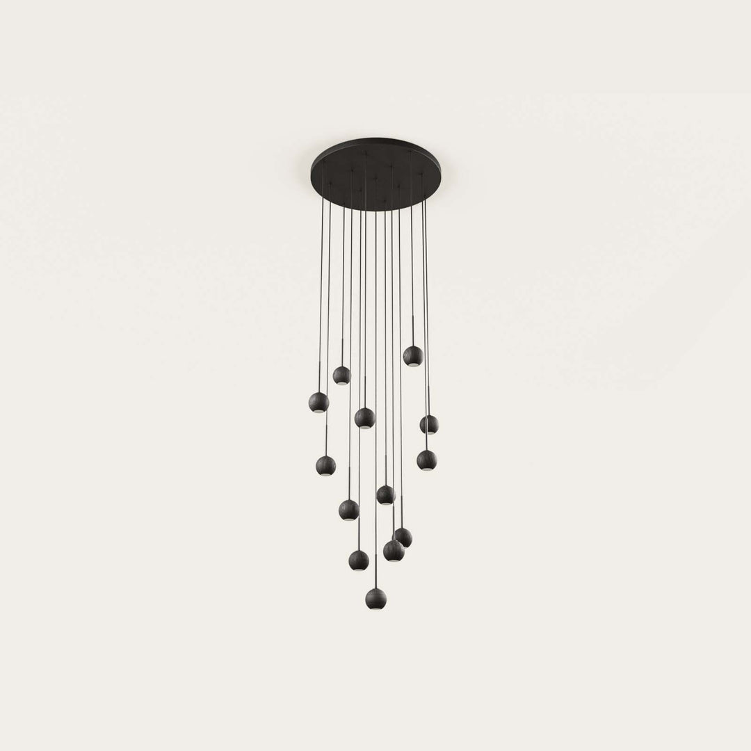 Lita Composition cluster of small matt black globe pendants from a round ceiling canopy, by Aromas del Campo