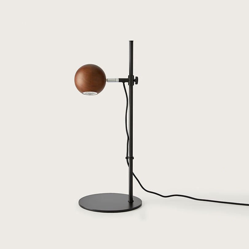 Lita Table Lamp with walnut sphere shade on an adjustable black steel rod and round base, by Aromas del Campo